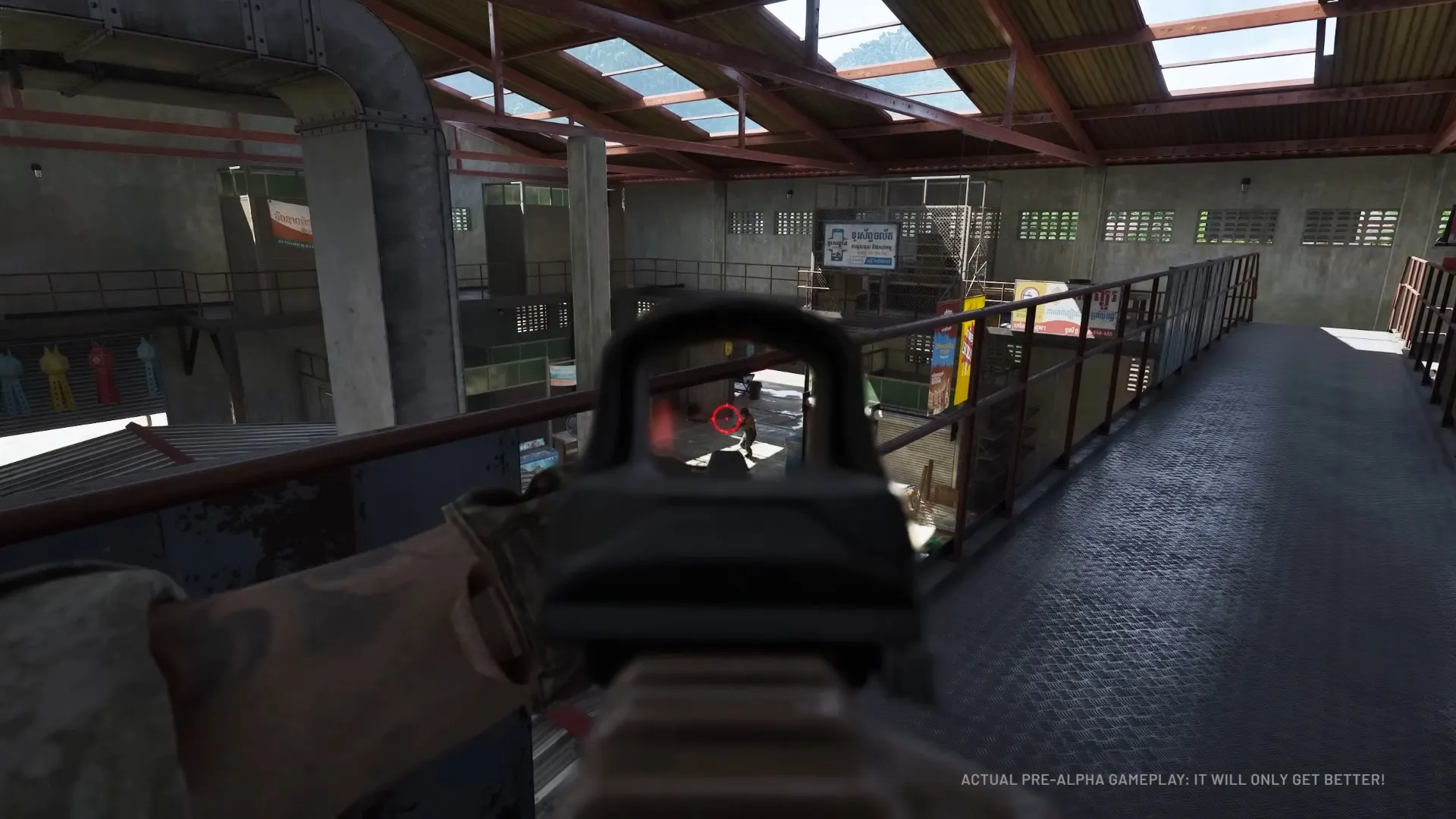 Gray Zone Warfare player aiming a red dot sight at an enemy from a market walkway